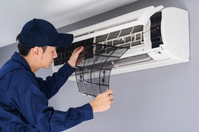 technician-service-removing-air-filter-air-conditioner-cleaning_35076-3617-640×426
